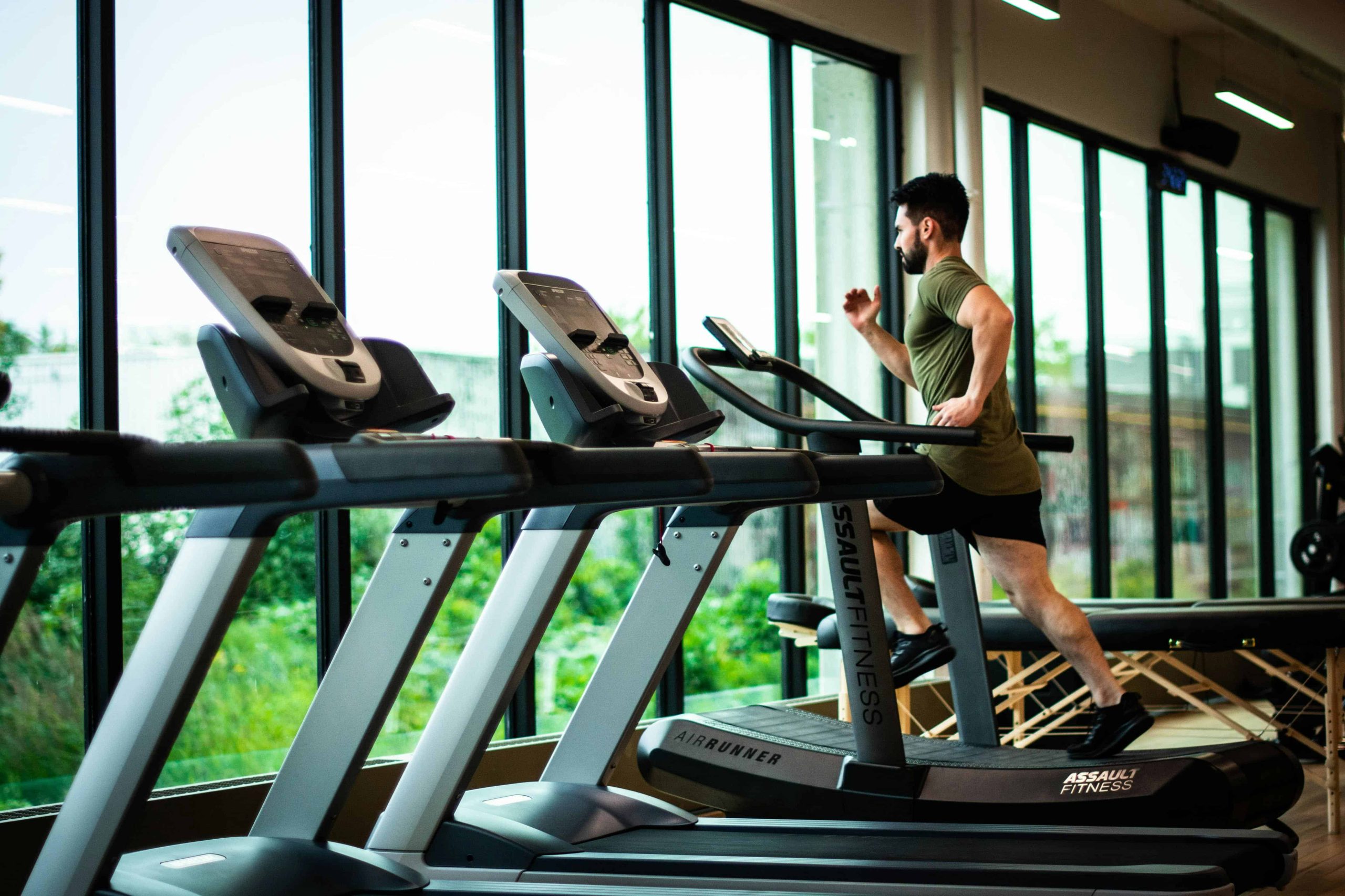 man running at gym